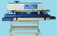 Automatic Sealing Machine by Emerick Automation India Private Limited