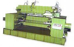 LOG PEELING LATHE MACHINE (with Hydraulically operated Backup Rollers) by Tharamal Exports