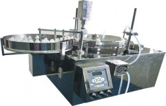 Automatic Liquid Filling Machine by Ravel Hiteks Pvt Ltd